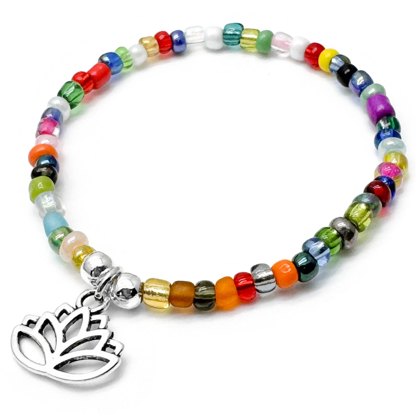 A colorful beaded bracelet with a metal charm featuring a lotus flower design.