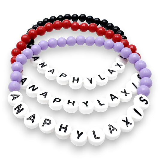 A collection of colorful beads arranged in a circular pattern, with each bead spelling out a word.